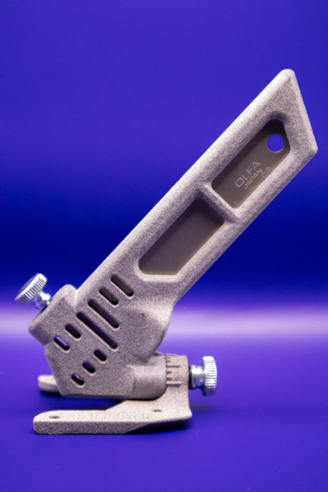 Gray Blade holder on Blue Background