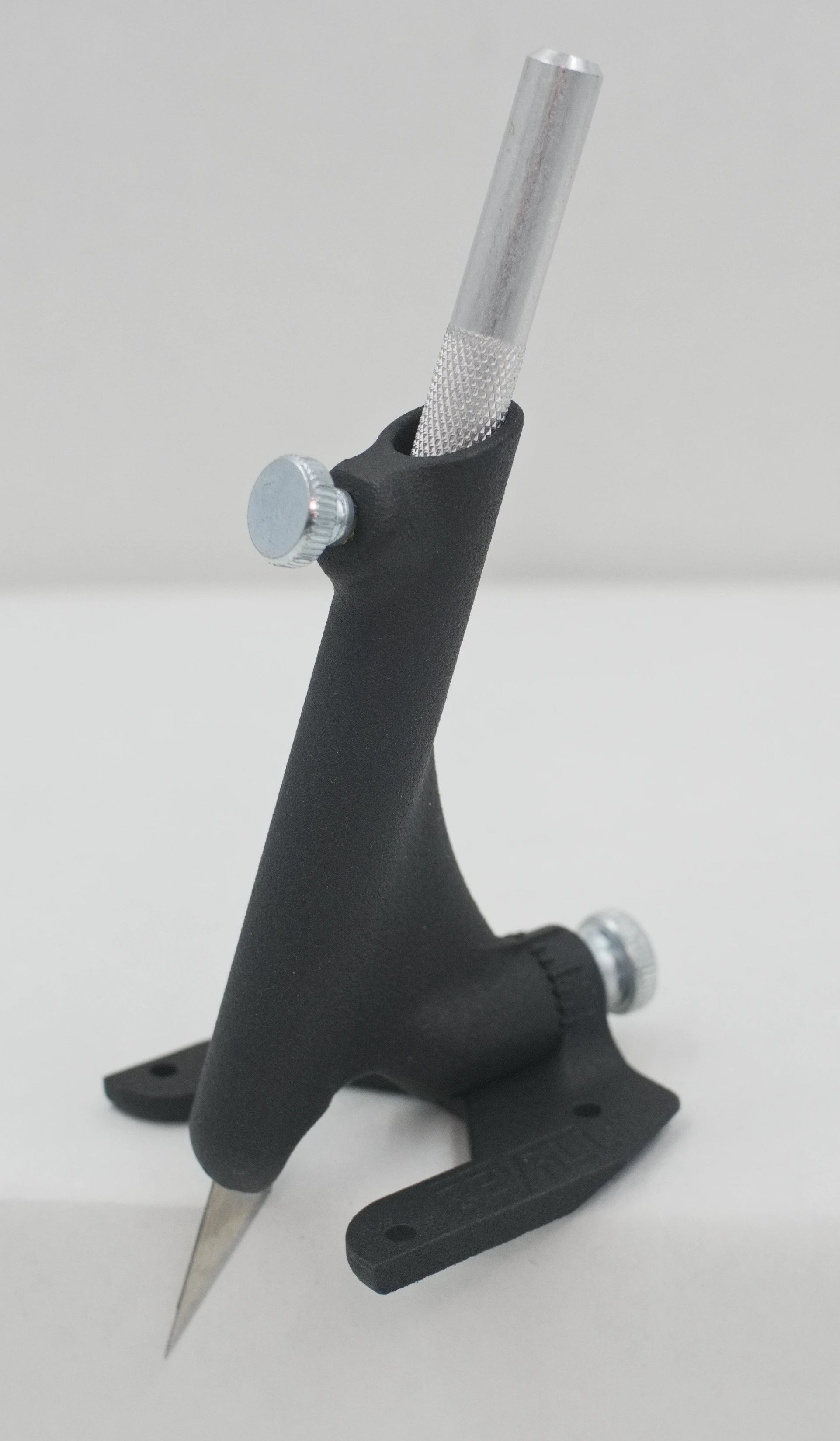 Black metal tool on a white background