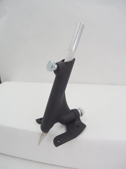 Black metal tool with a cylindrical handle on a white background